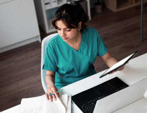 Healthcare professional reviewing patient records